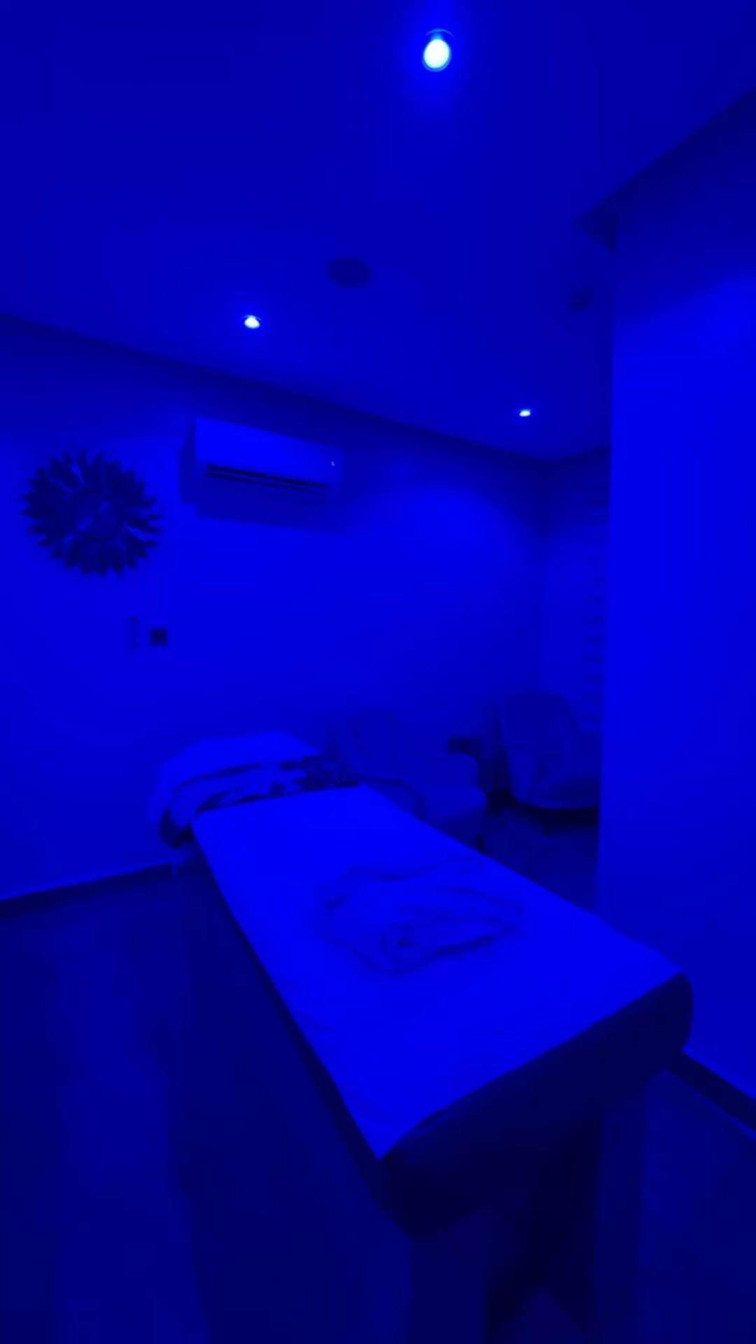 Ambient-lit private massage treatment room