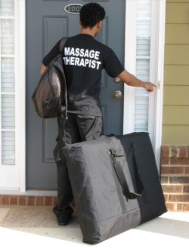 ADE Lux Spa therapist arriving with mobile massage equipment