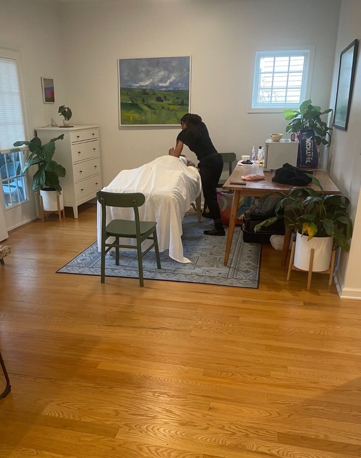 Therapist at work during an in-home massage session